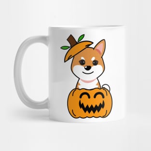 Funny orange dog is in a pumpkin Mug
